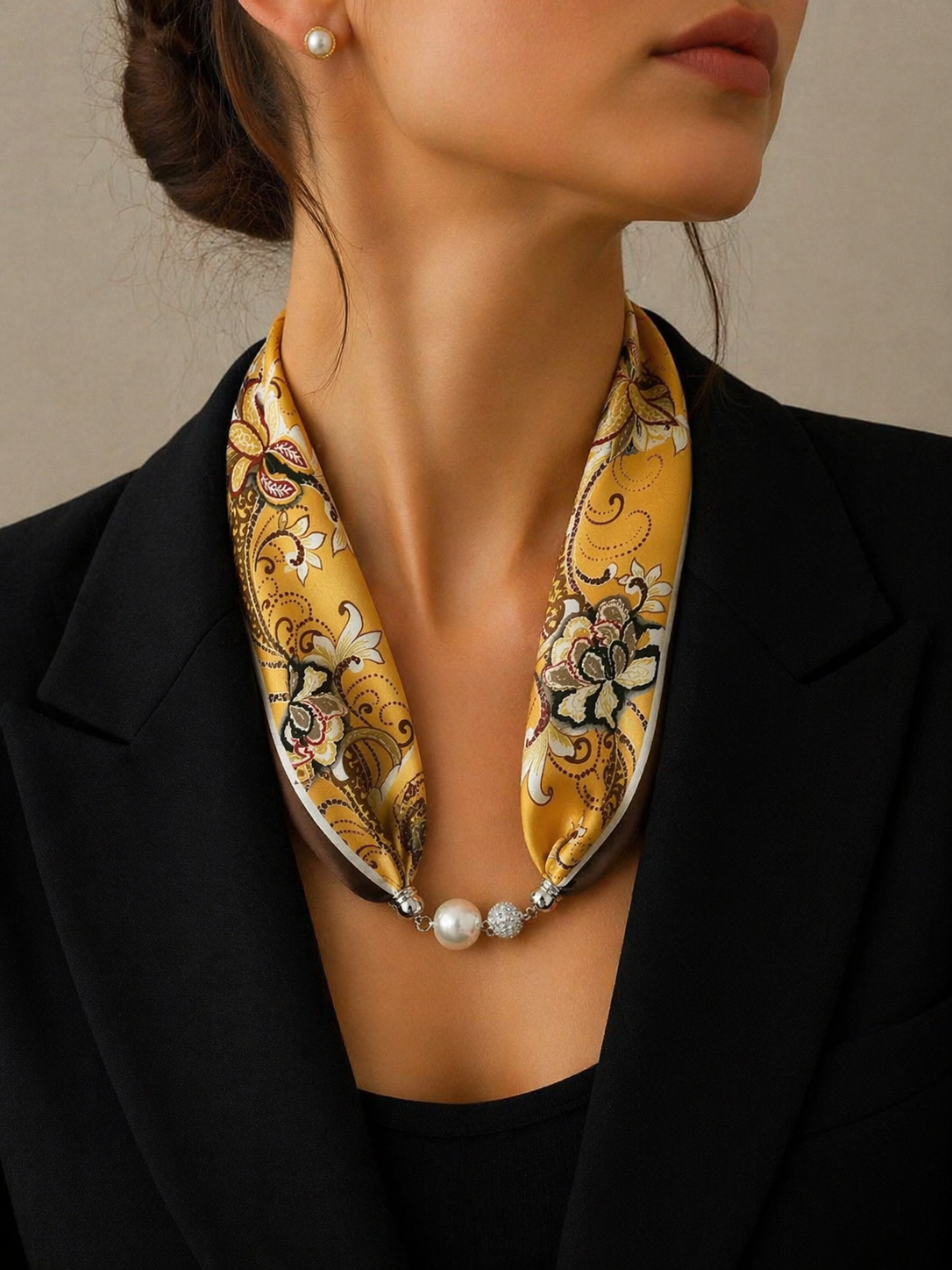 Yellow-Brown Silk Scarf with Paisley Pattern and Pearl Necklace